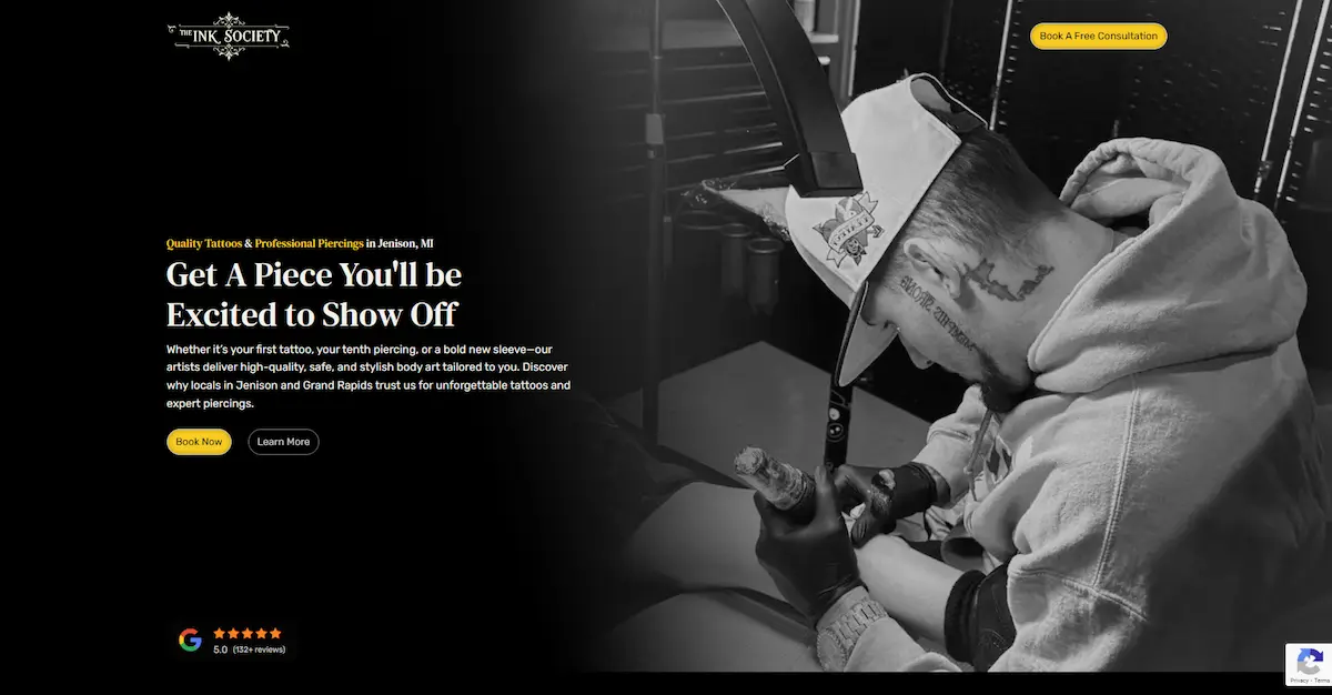 Hero section of The Ink Society website with bold branding, showcasing tattoo artistry and piercing services in Grand Rapids